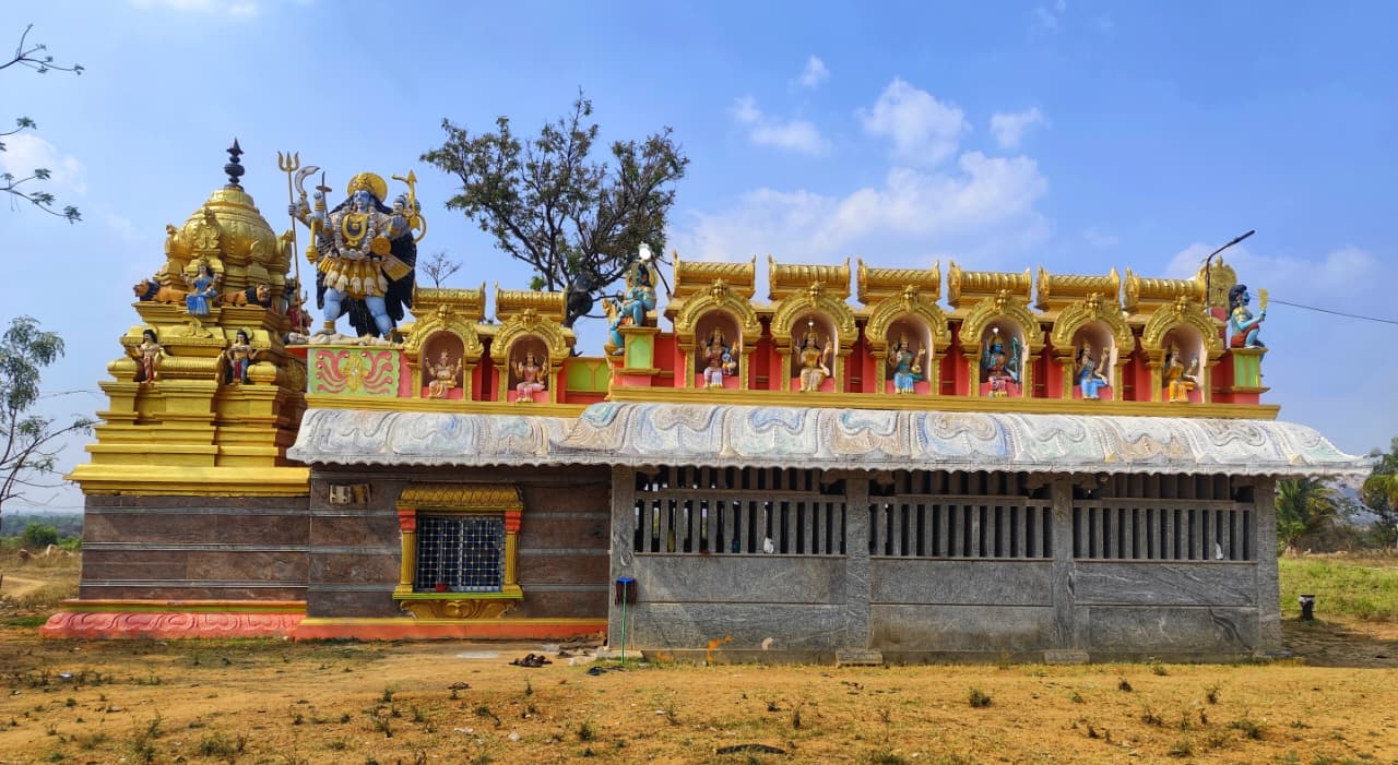 Sri Adhiparashakthi Temple with golden gopuram and divine statues